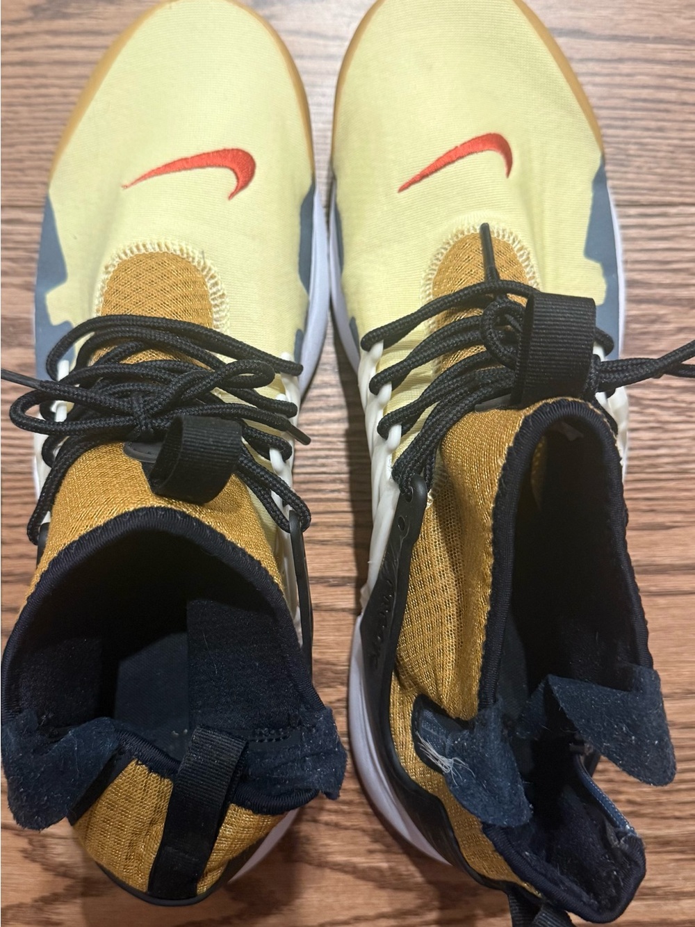 Nike Kids Yellow Sneakers with Red Swoosh and Black Accents